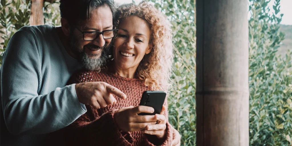 Couple enjoying time together using a smartphone.